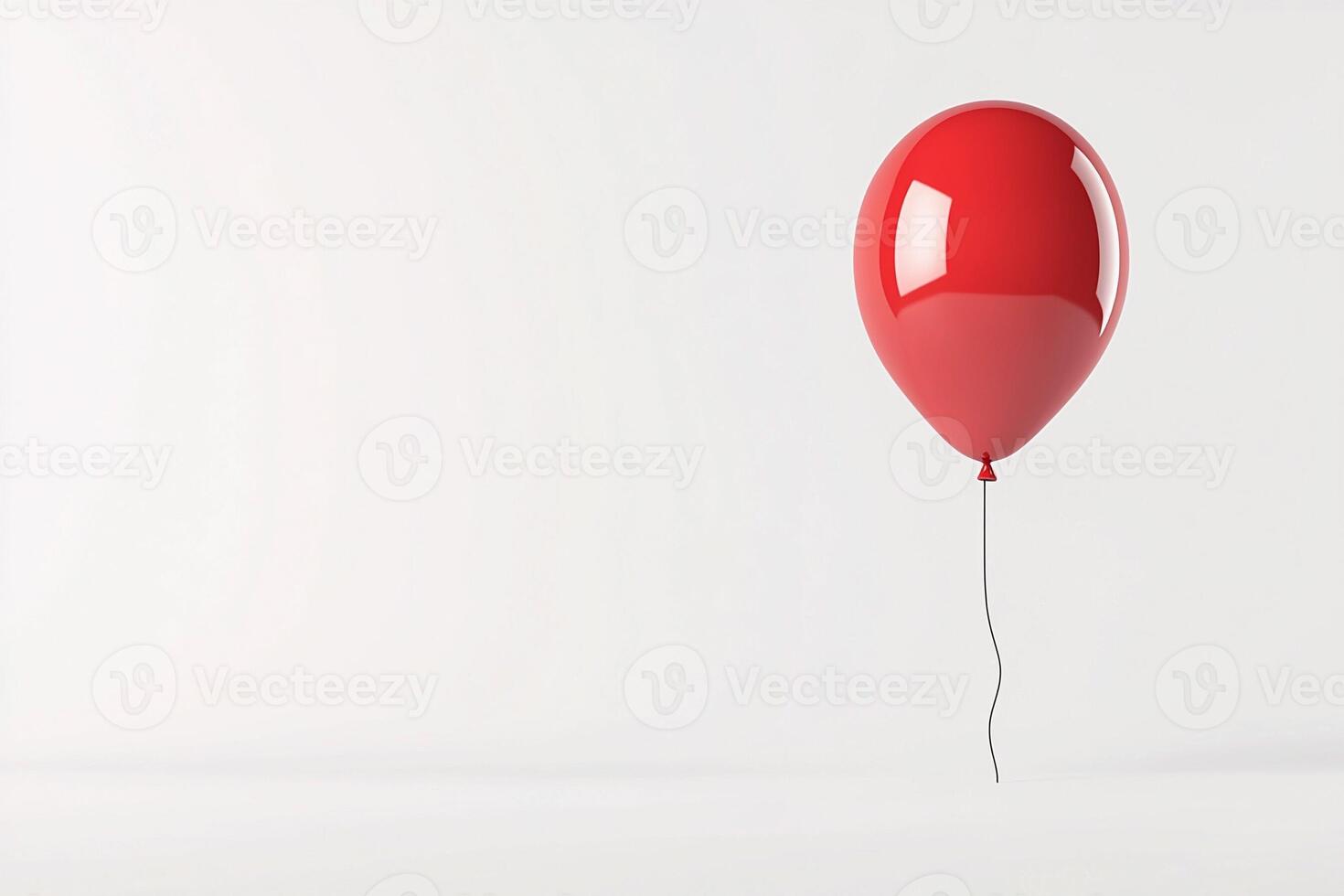 A red balloon floating in the air photo