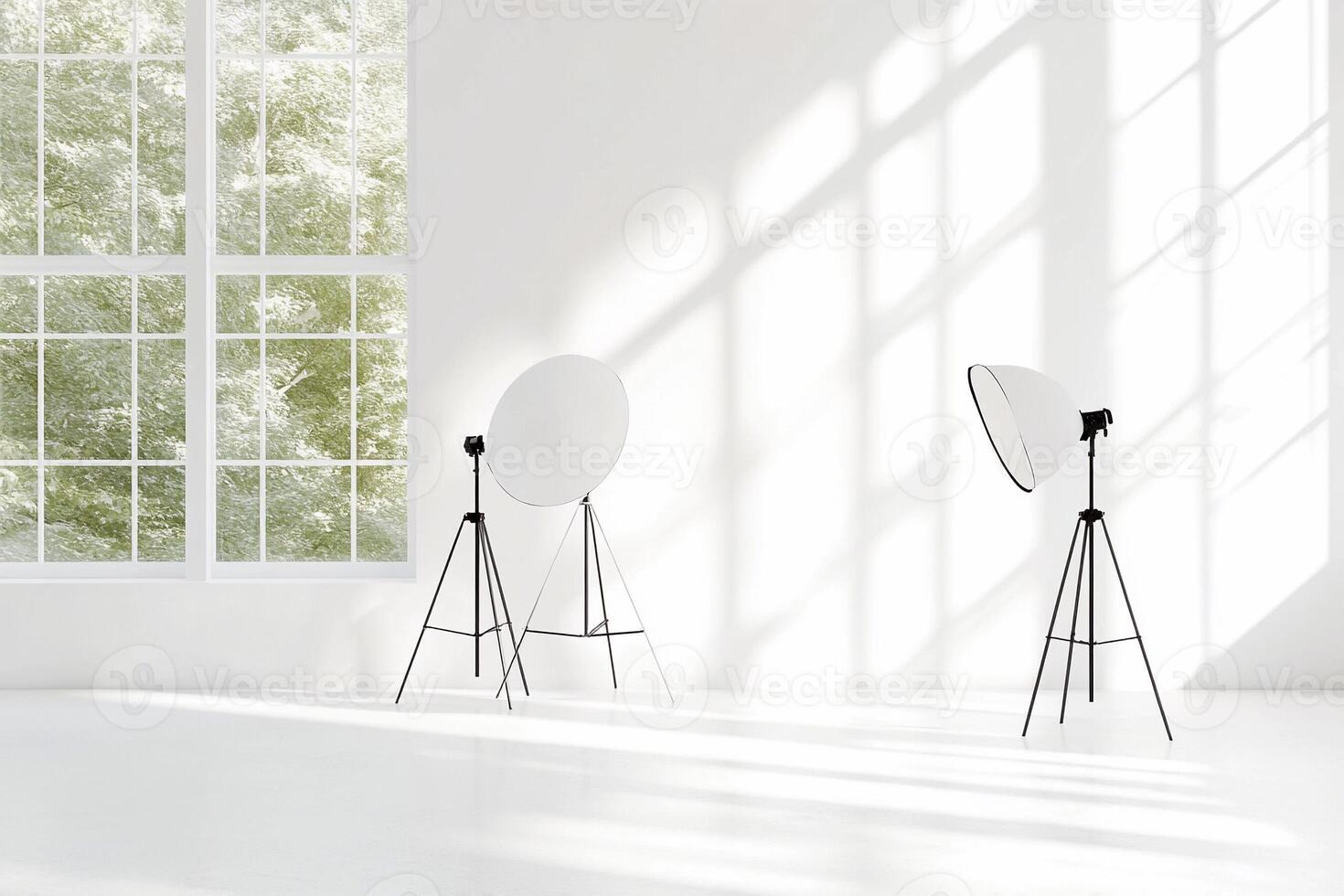Three white lights and a tripod in an empty room photo