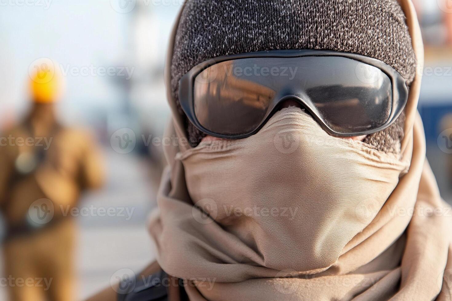 A man wearing a mask and a scarf photo