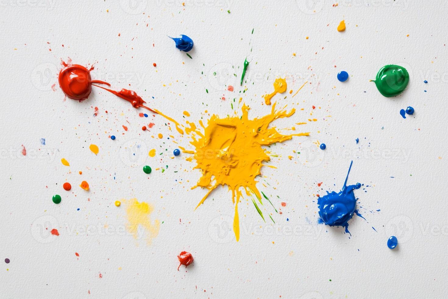 Colorful paint splatters on white background photo