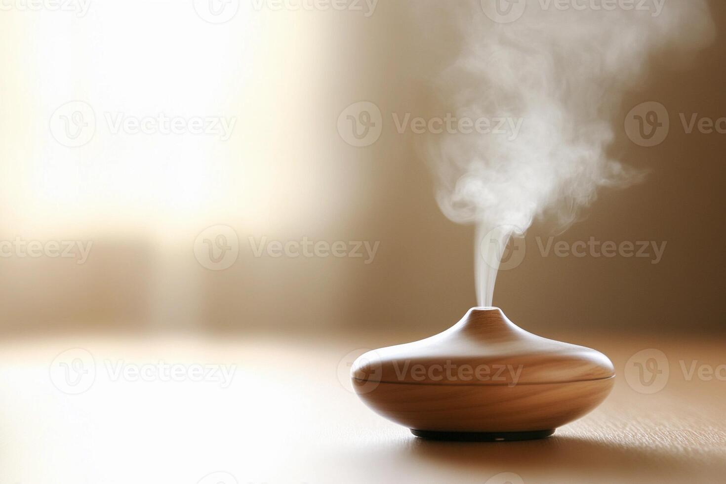 A small wooden aroma diffuser is on a table photo