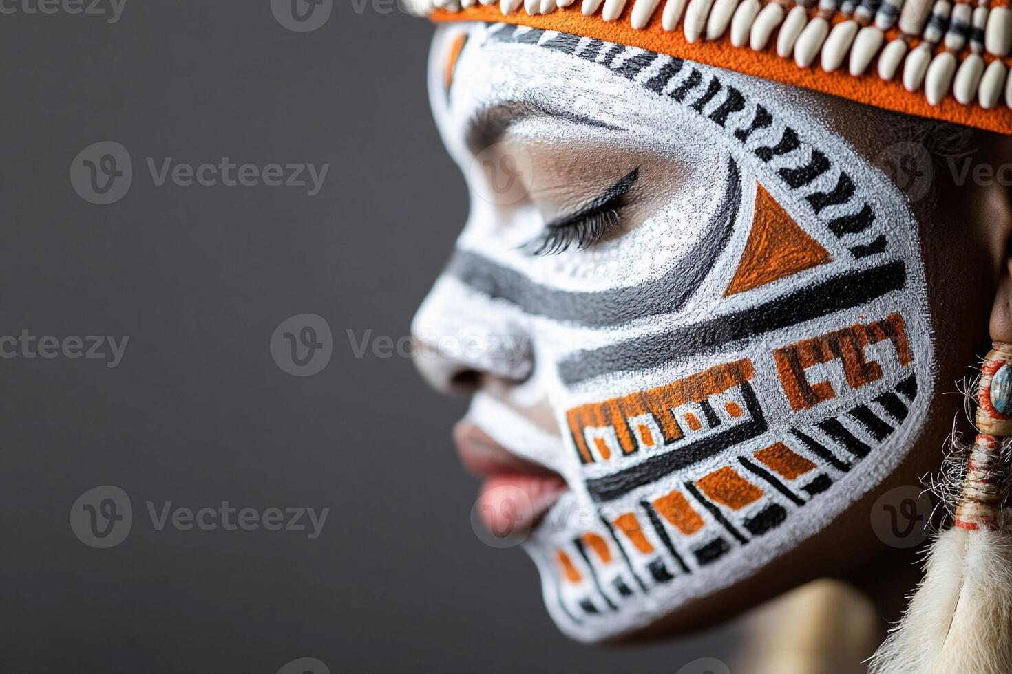 African woman with painted face and earrings photo