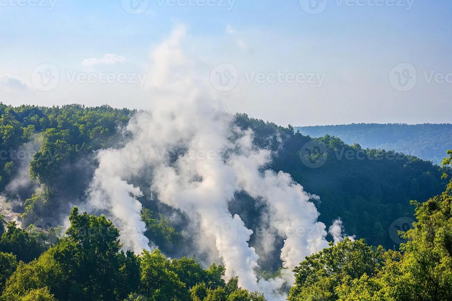 Steam coming out of a geyser in the woods photo