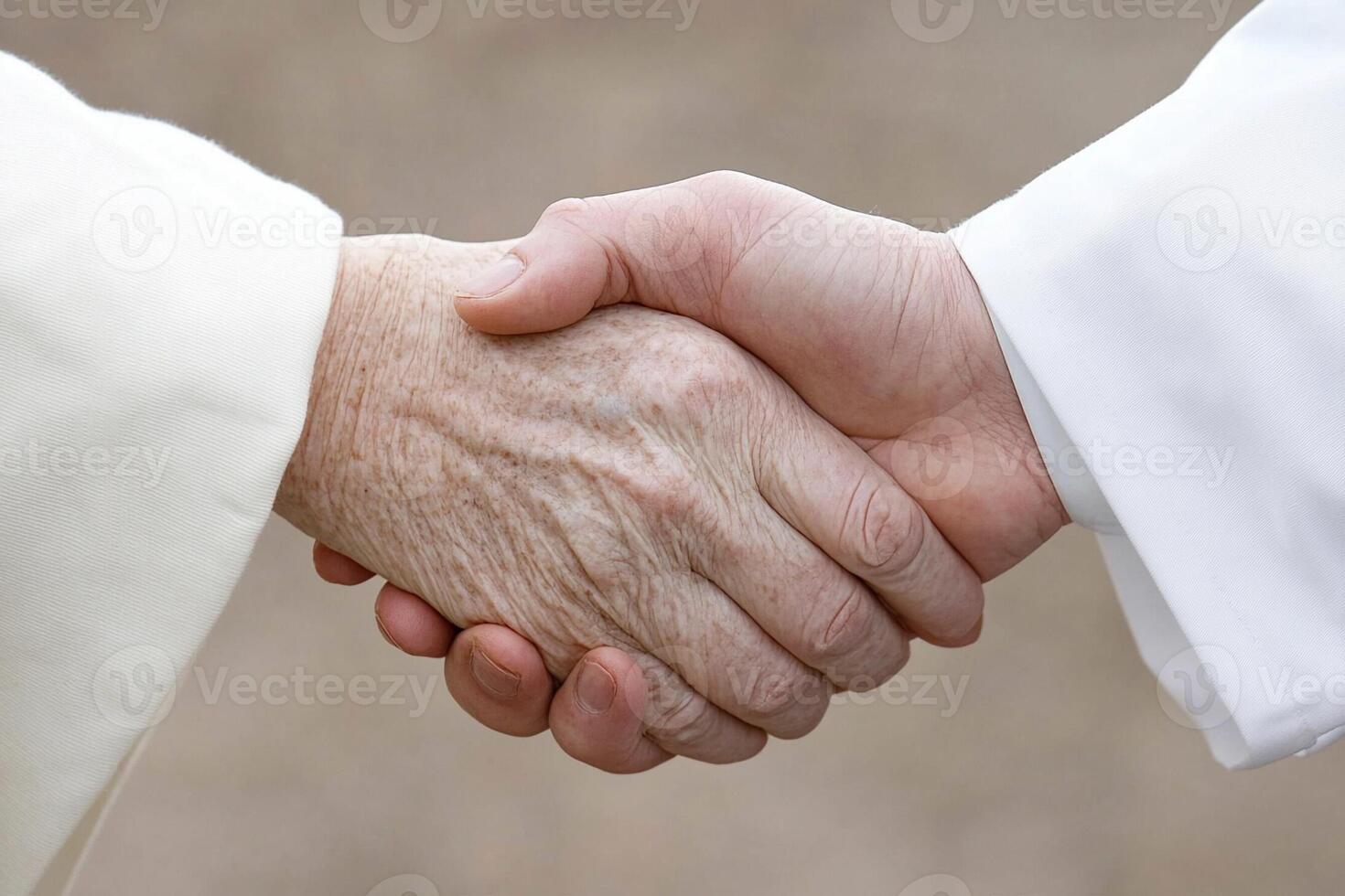 A close up of two people shaking hands photo