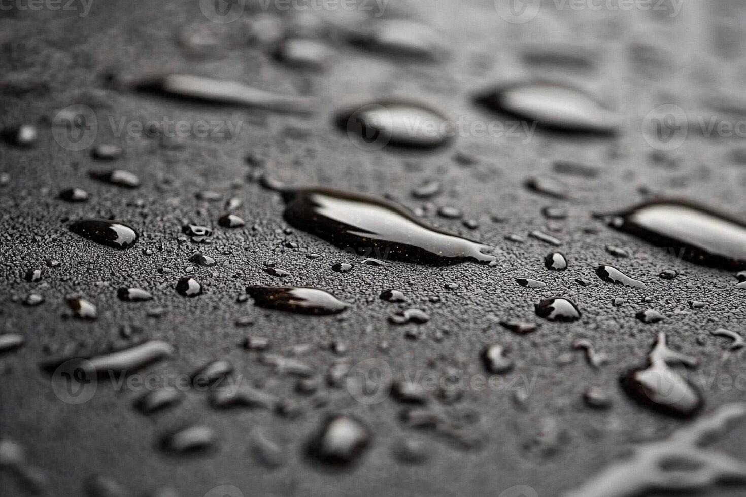 Water droplets on a black surface photo