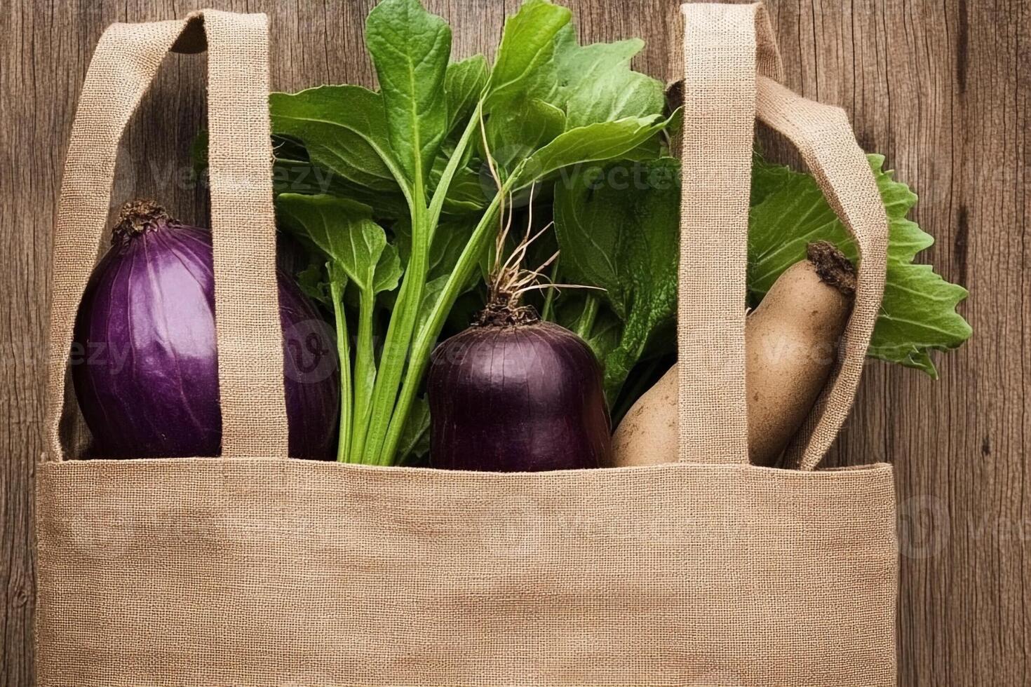 A bag filled with vegetables on a wooden table photo