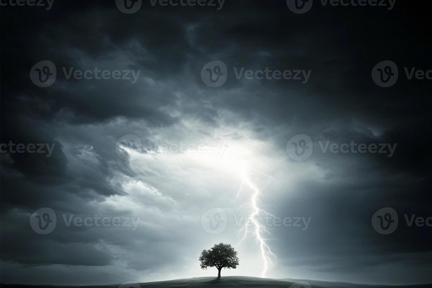 A lone tree in the middle of a field with lightning coming from the sky photo