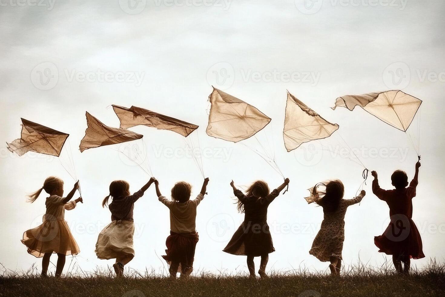 A group of children are flying kites in the sky photo