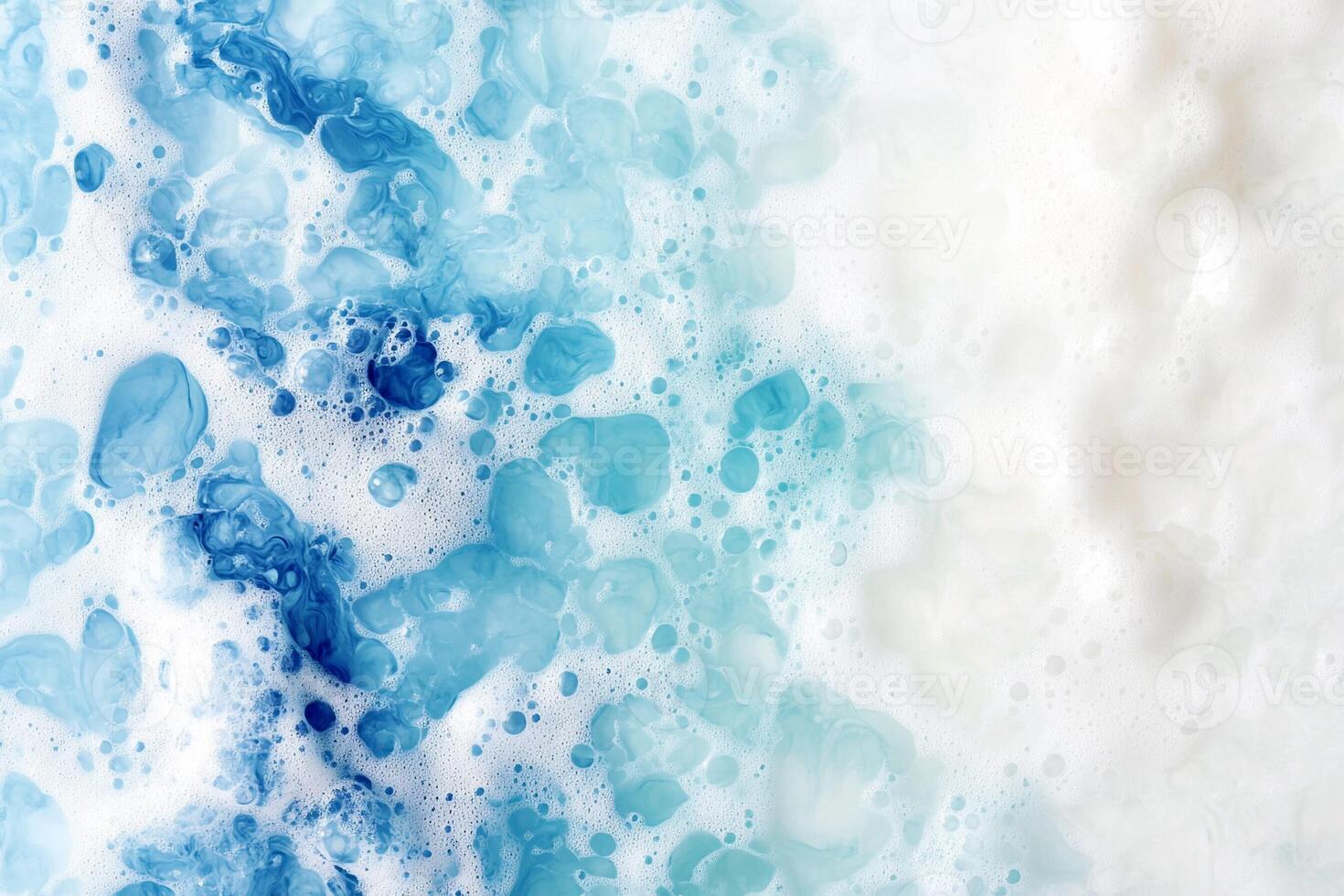 A blue and white foam with bubbles on it photo