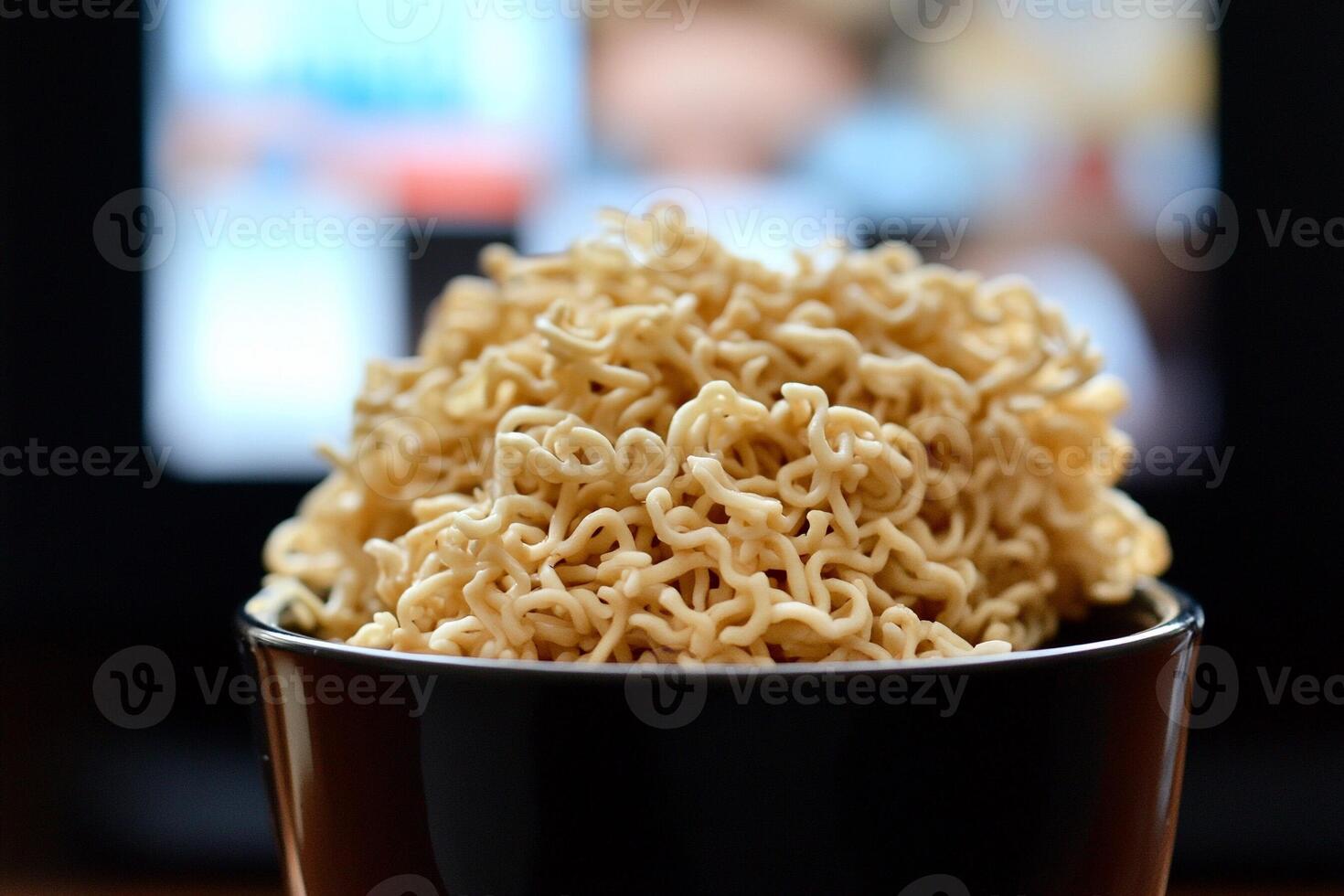 A bowl of noodles sitting on a table photo