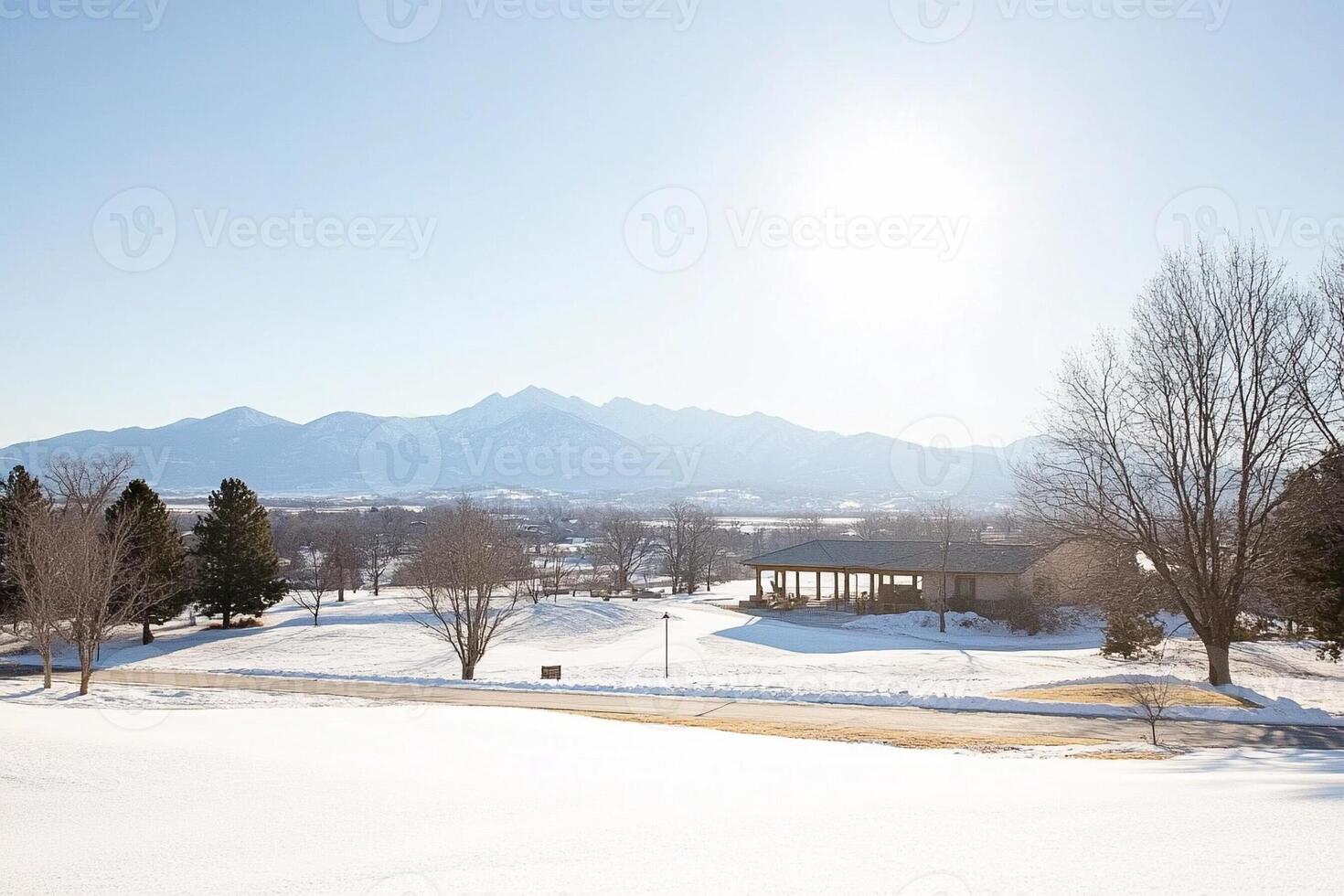 A view of the mountains and snow covered fields photo