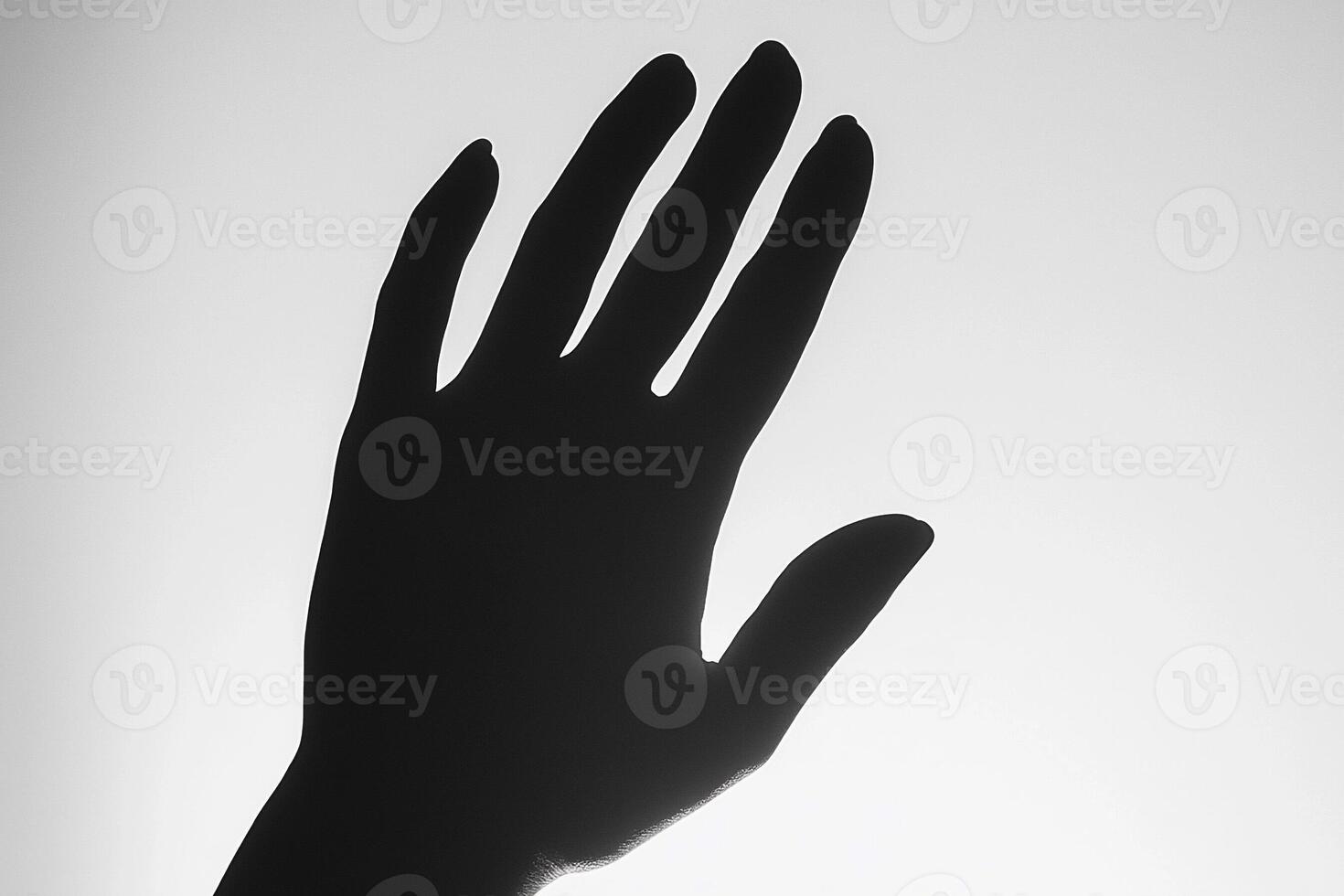 A hand is shown in silhouette against a white background photo