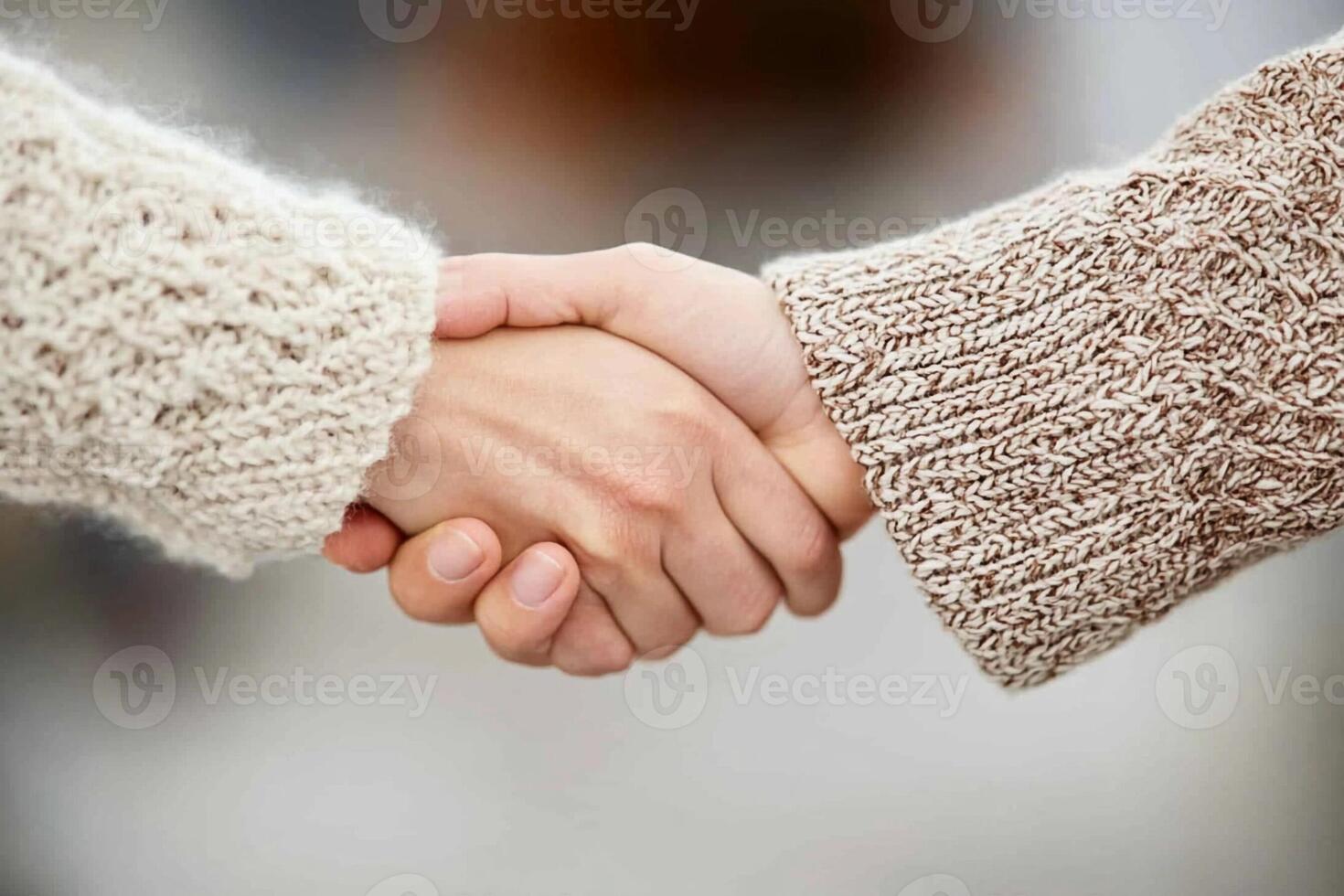 Two people shaking hands in a group photo