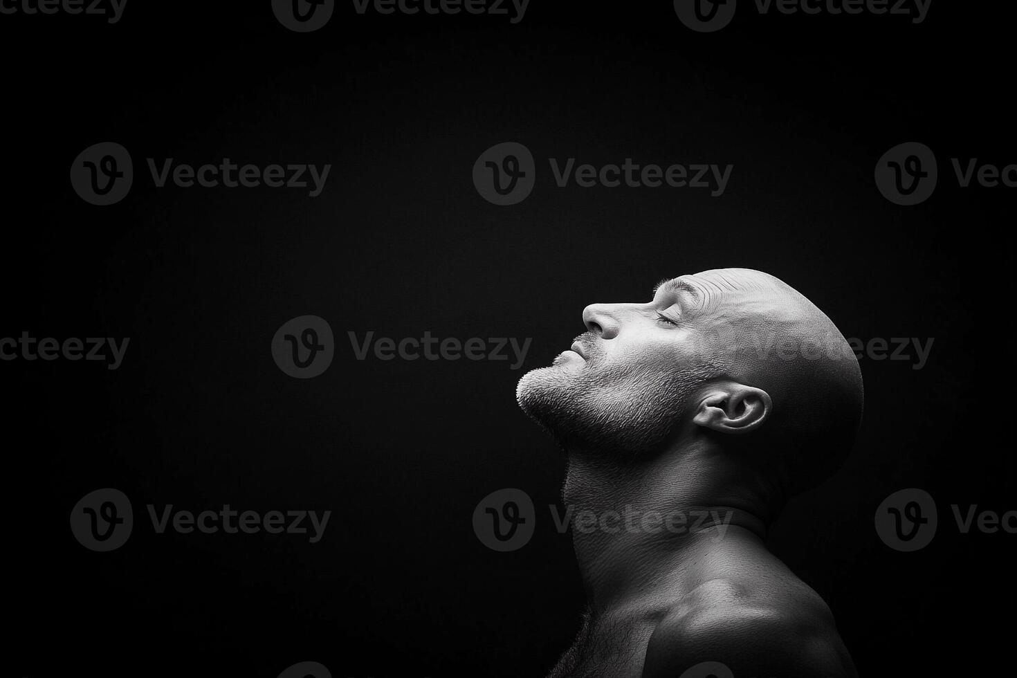 A bald man looking up in the air photo