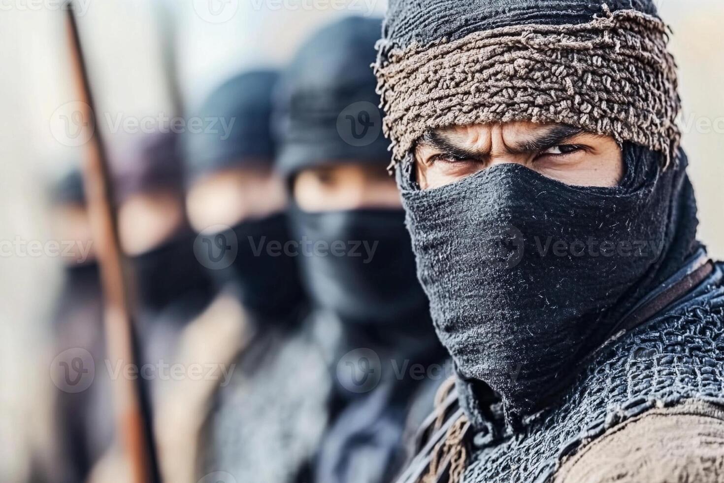 A group of men wearing masks and holding weapons photo