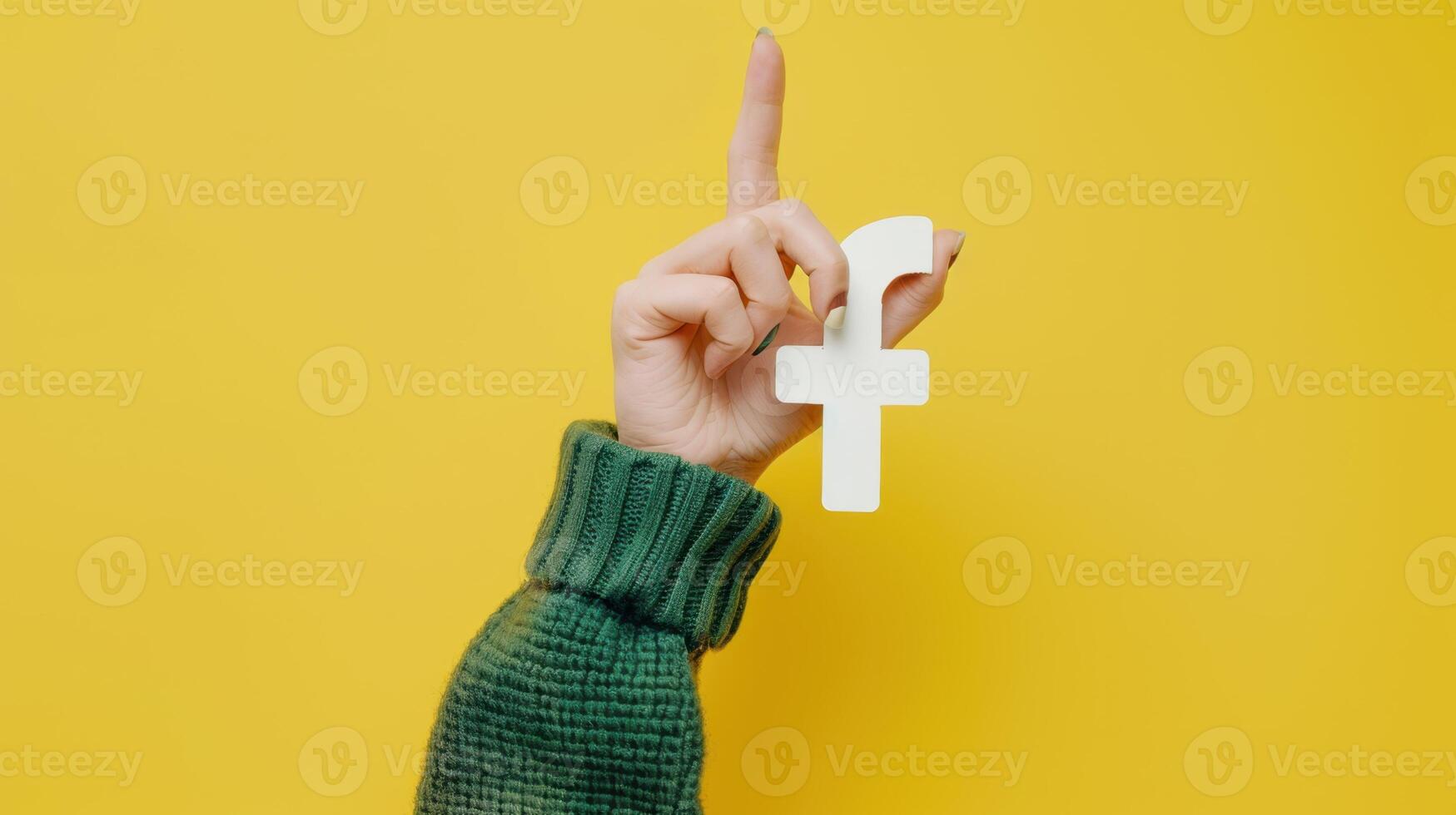 The hand holding Facebook icon photo