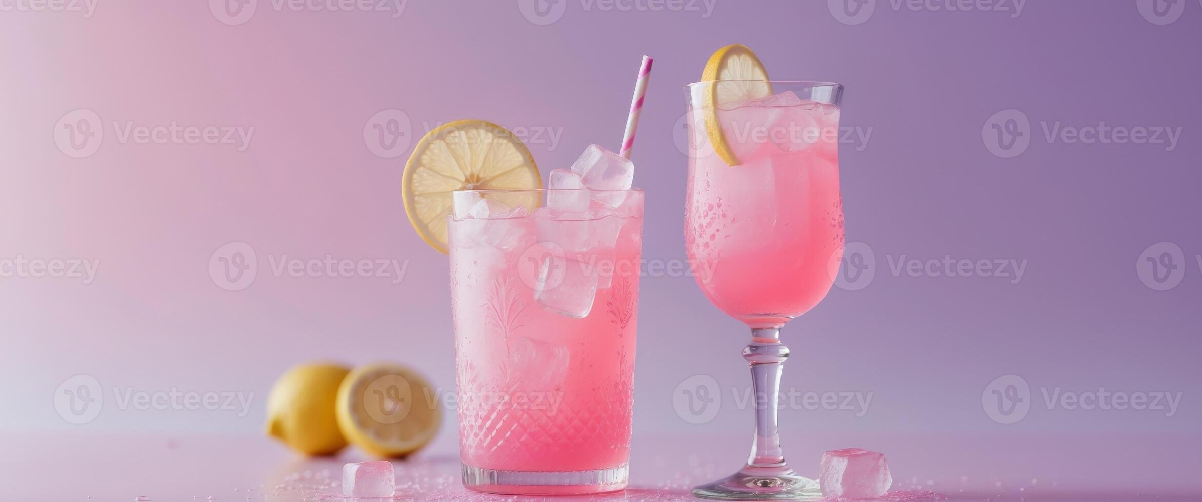Refreshing Pink Lemonade with Lemon Slice and Ice Cubes in a Decorative Glass - The Ultimate Summertime Drink on a Soft Pink and Purple Background photo