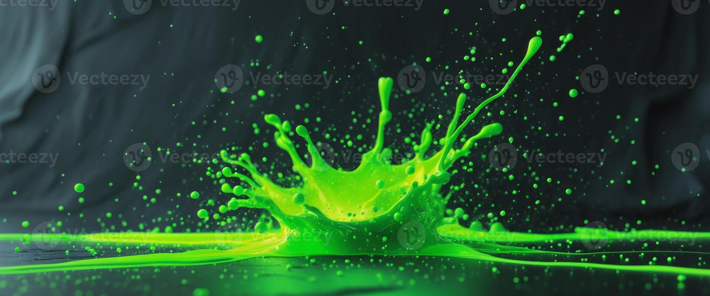 Green liquid splashing on a black background photo