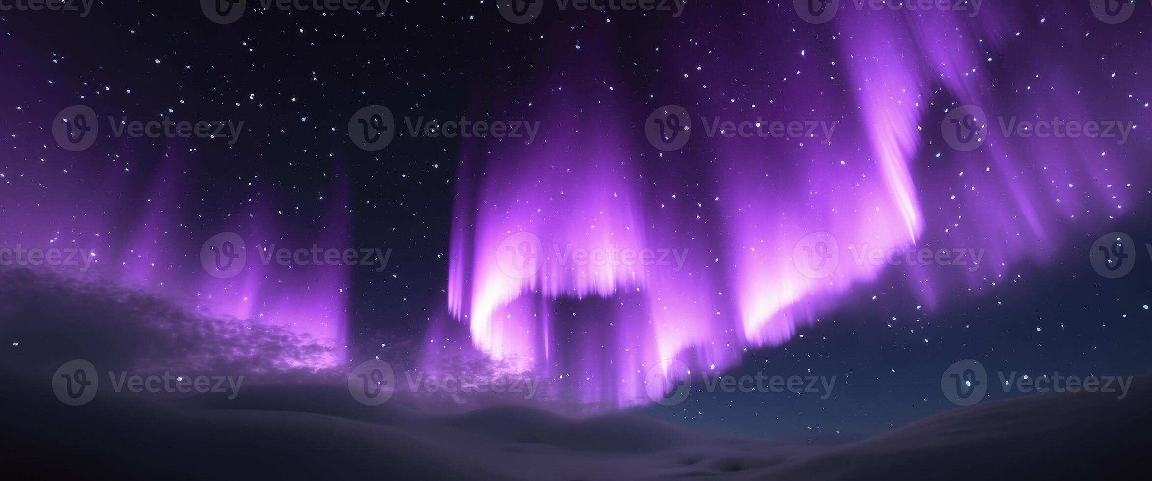 The aurora borealis is seen in the sky above a snowy mountain photo