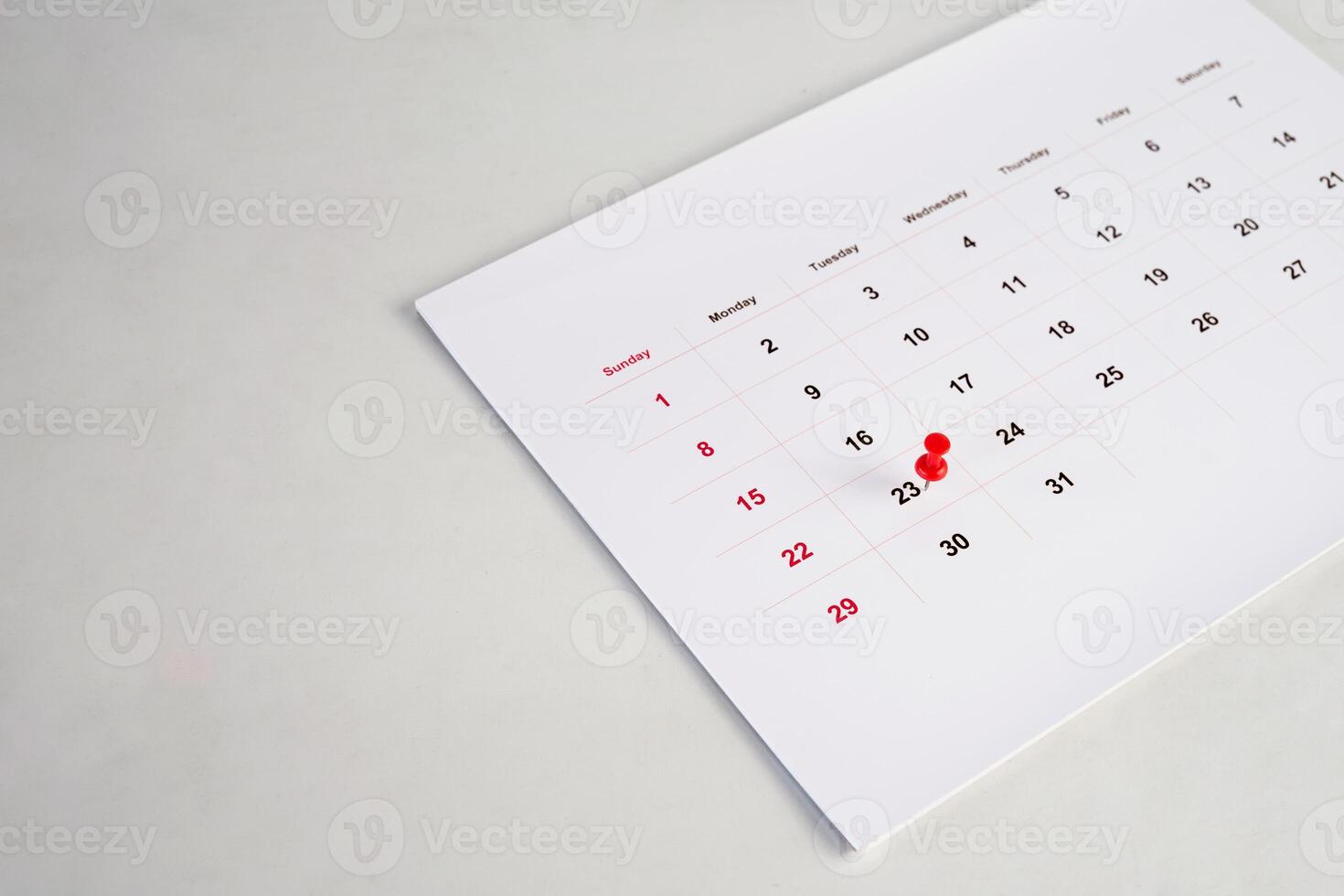red pin stack on calendar photo