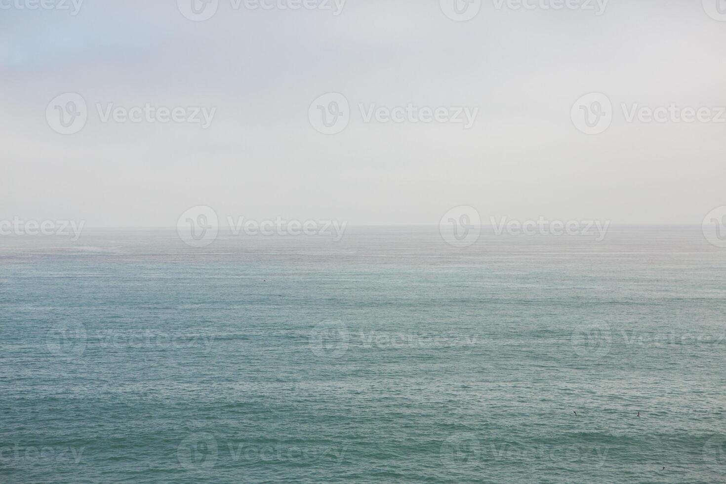 the horizont line over pacific ocean photo