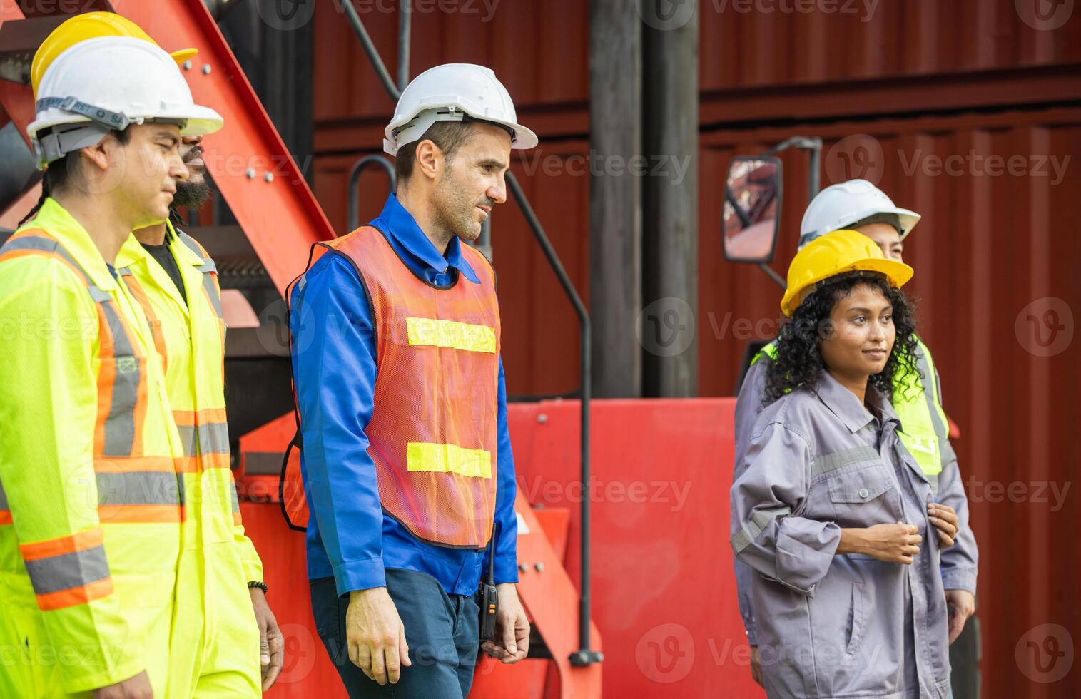 Logistics manager and engineers foreman workers team at shipping container yard, Diverse team of workers at cargo photo