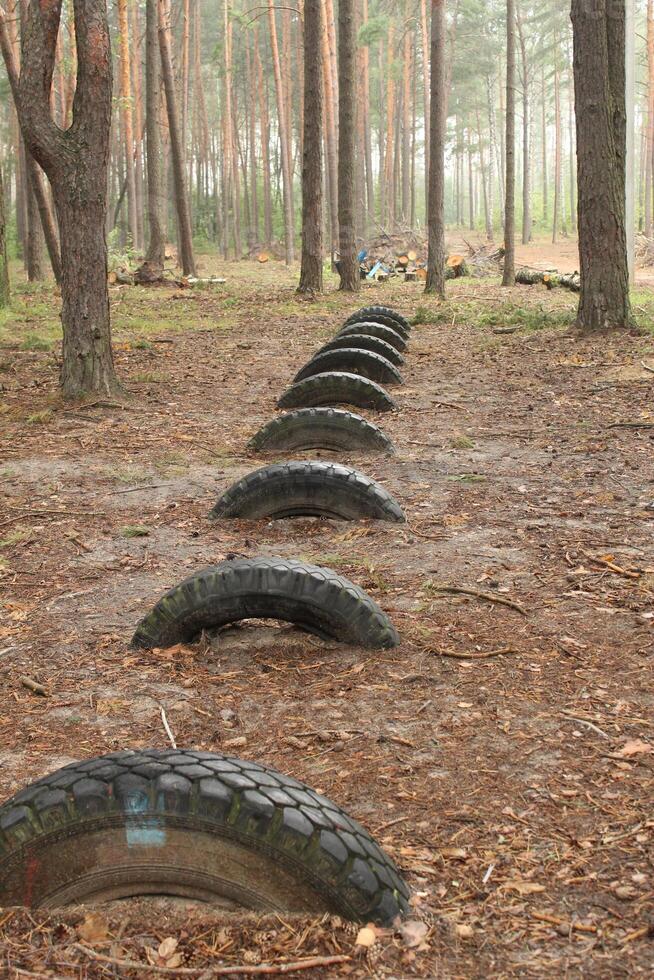 Car tires are lying on the ground. Resource reuse. photo