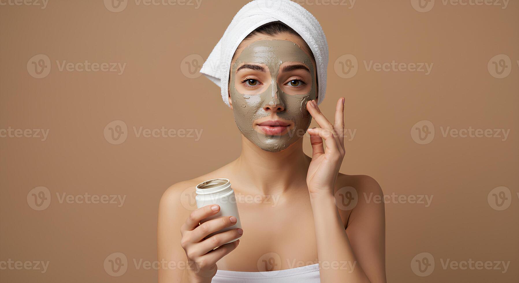 Close-up of a woman using a kaolin clay face mask to deep clean pores and control shine. Natural skincare concept for healthy, oil-free skin photo
