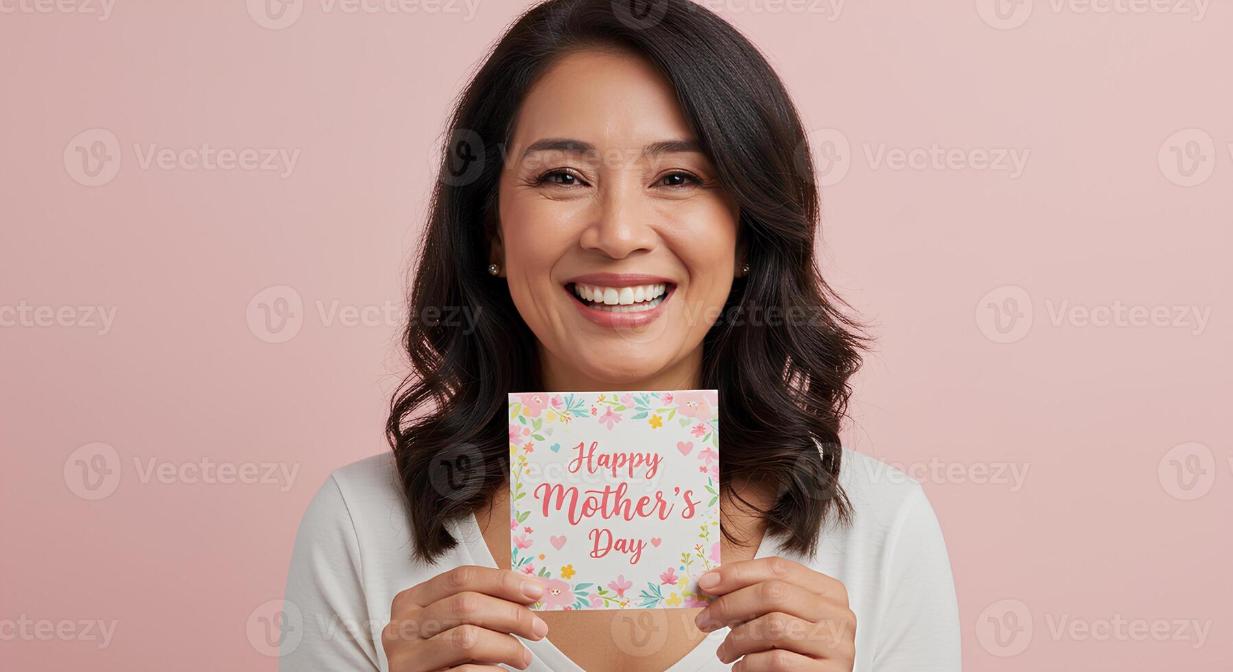 Radiant woman expressing joy while holding a Happy Mother's Day card, perfect for campaigns celebrating maternal love and family values photo