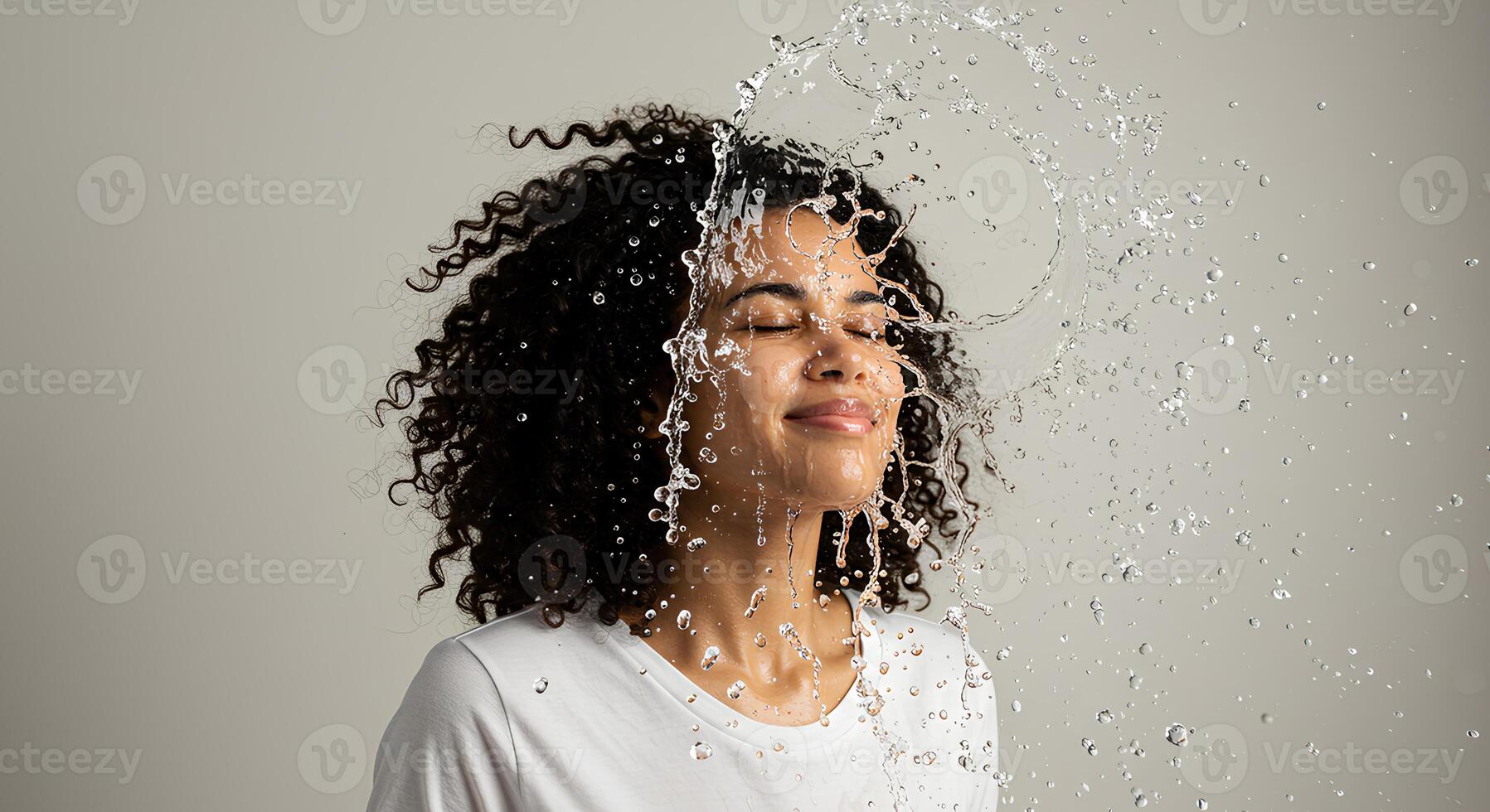 Close-up of a woman cleansing her face with water. Refreshing skincare and beauty concept with glowing and youthful skin photo