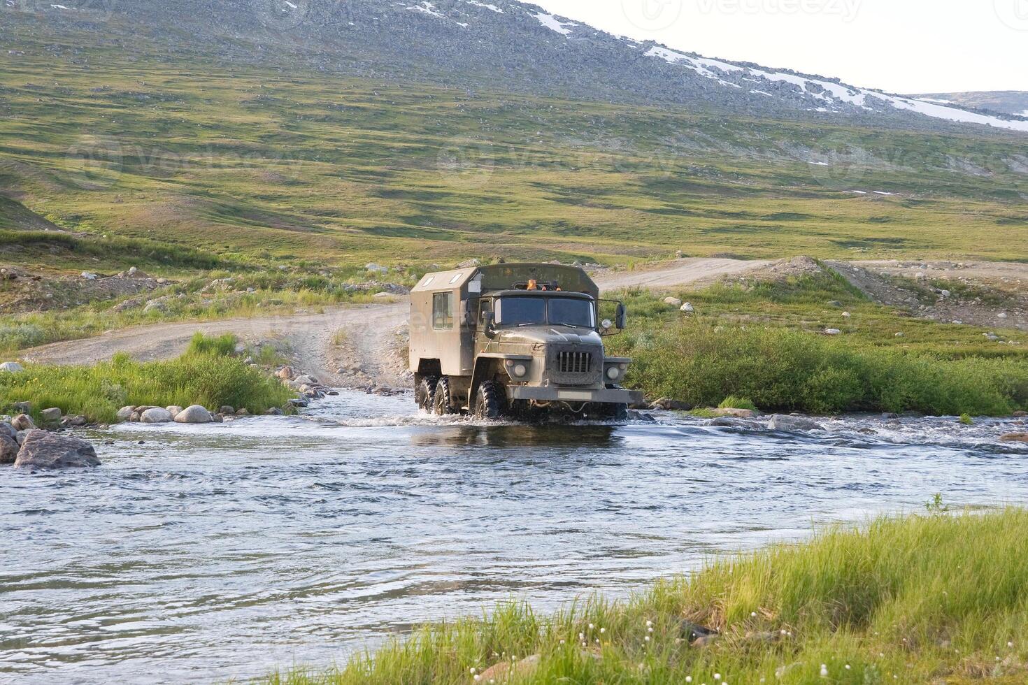 Truck crossing a river 2 photo