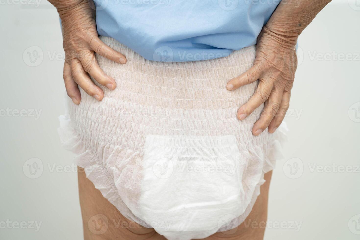 Asian senior woman patient wearing adult incontinence diaper pad in photo
