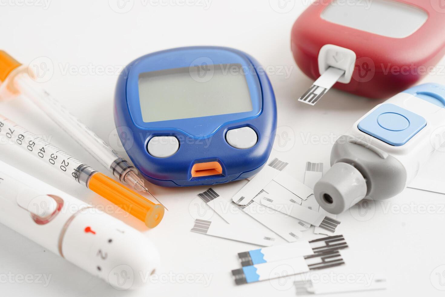 Glucometer lancet and test strips testing blood sugar for diabetes. photo