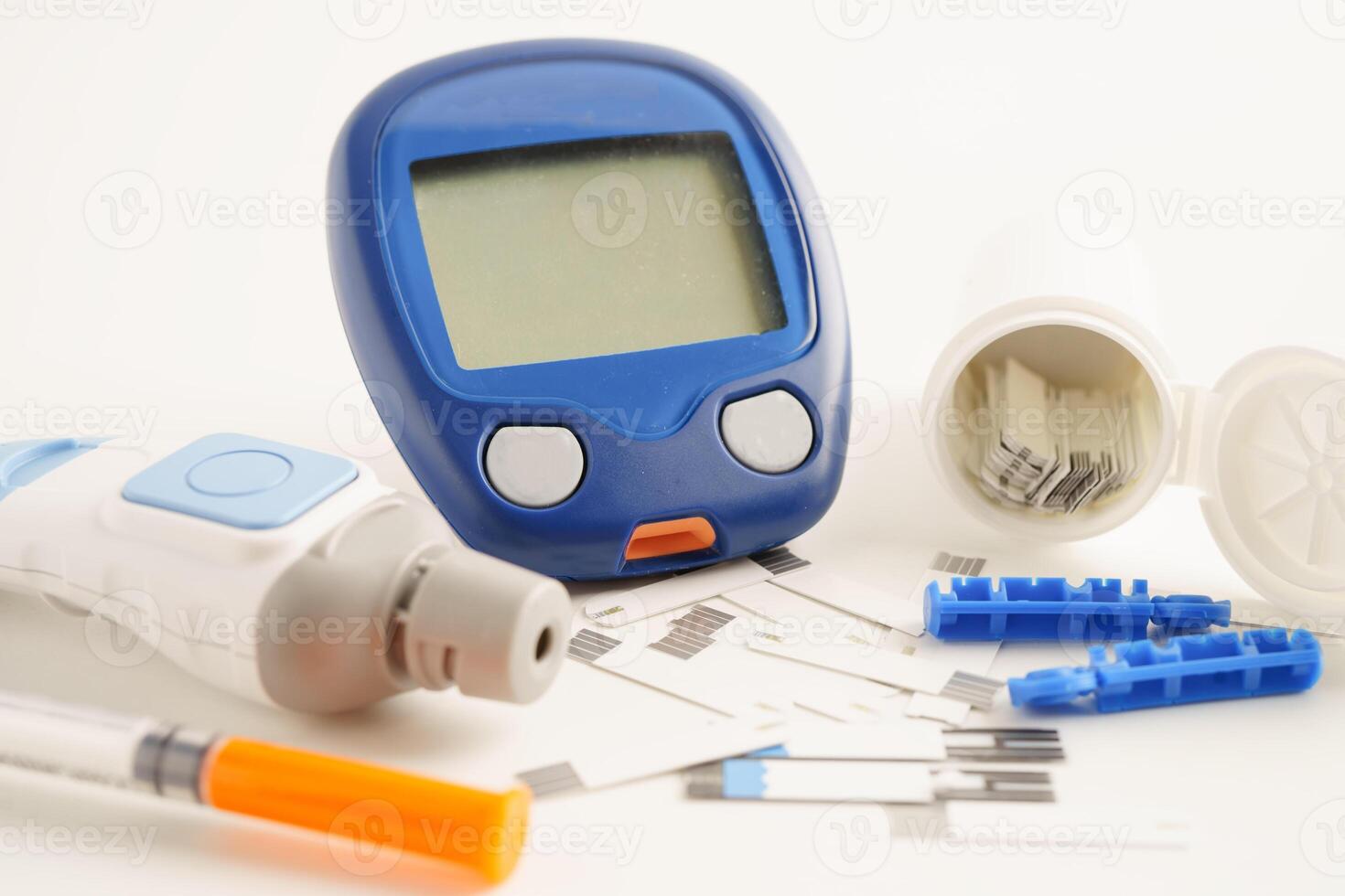 Glucometer lancet and test strips testing sugar for diabetes. photo