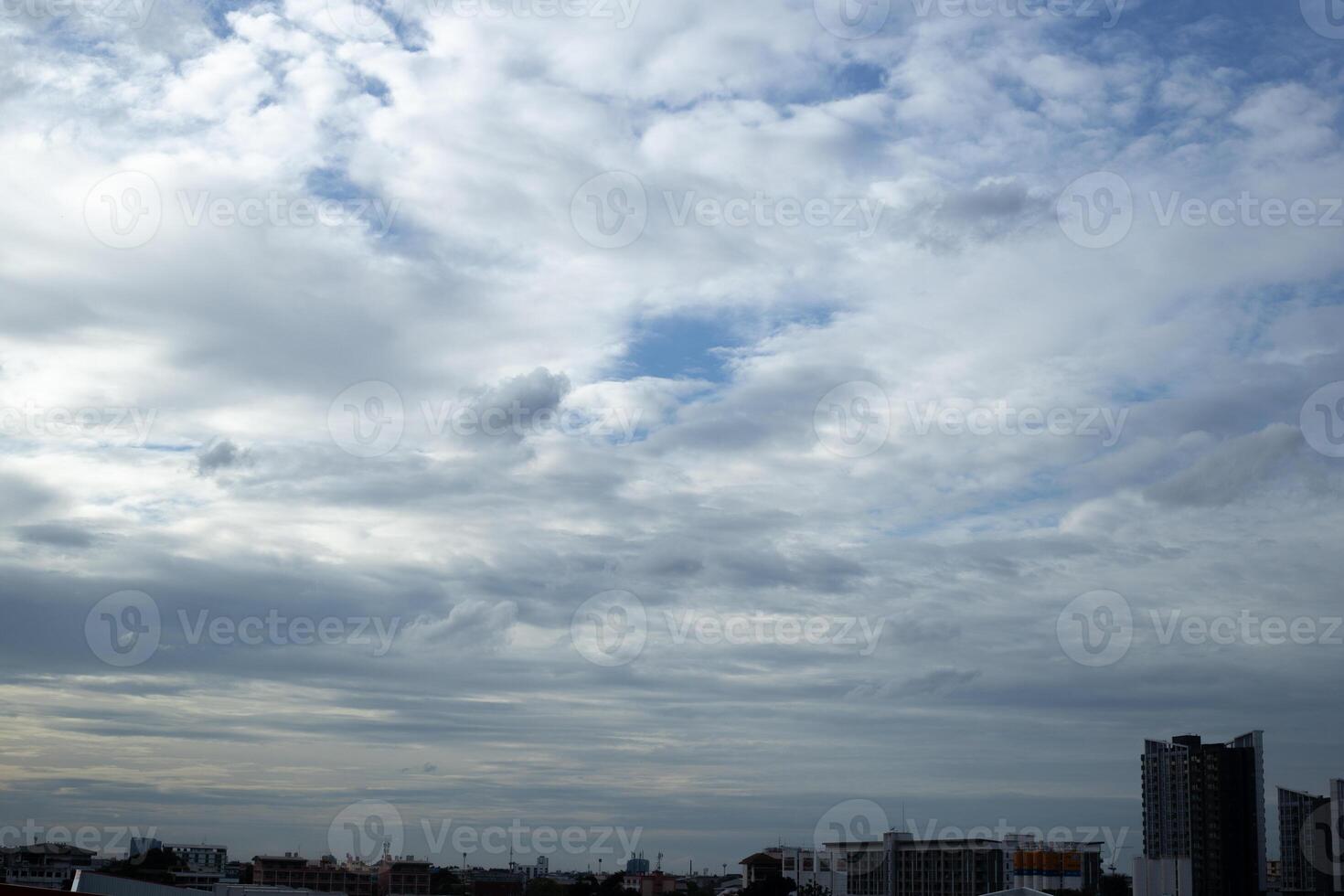 sunset twilight evening time dark blue sky with white cloud city building light midnight background photo