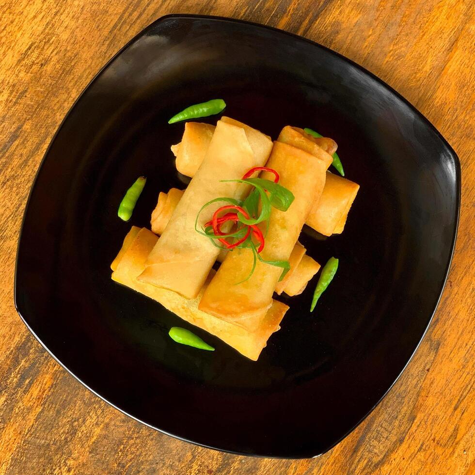 Crispy chicken spring rolls with chilli photo