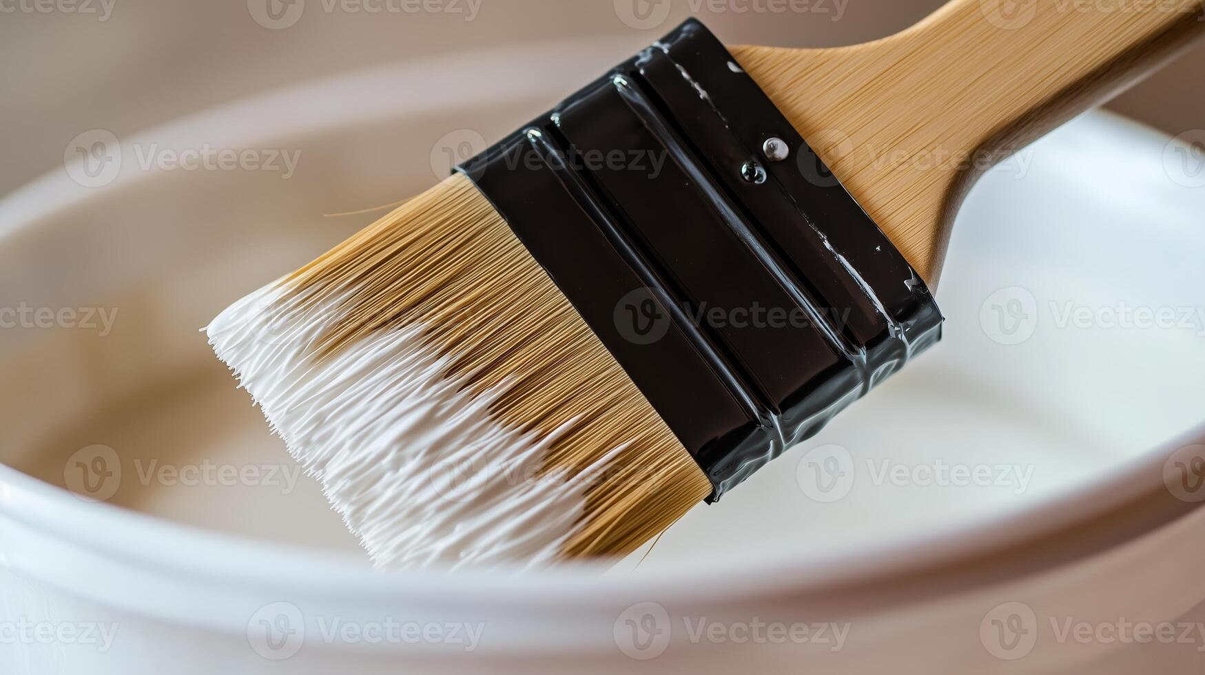 A paint brush with soft bristles and a fine texture is placed in a bucket. 1 photo