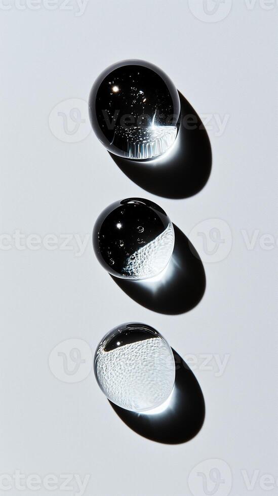 Different sizes and shapes of transparent droplets, symbolizing the diversity in beauty products. 4 photo