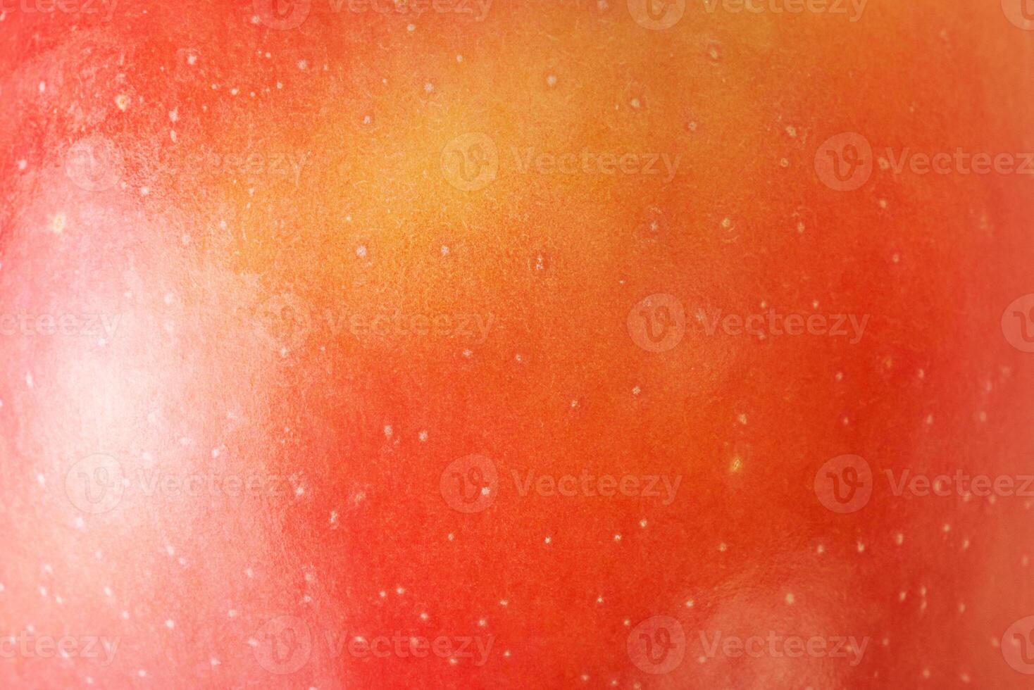 Macro photo of red apple texture with yellow color as background.