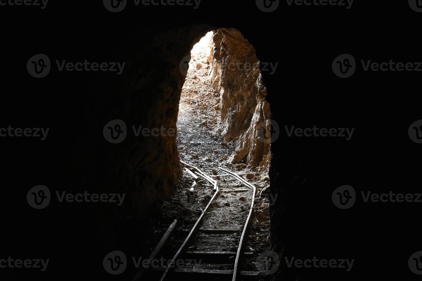 Abandoned Underground Mine Exit with Rail for Ore Carts in Arizona photo