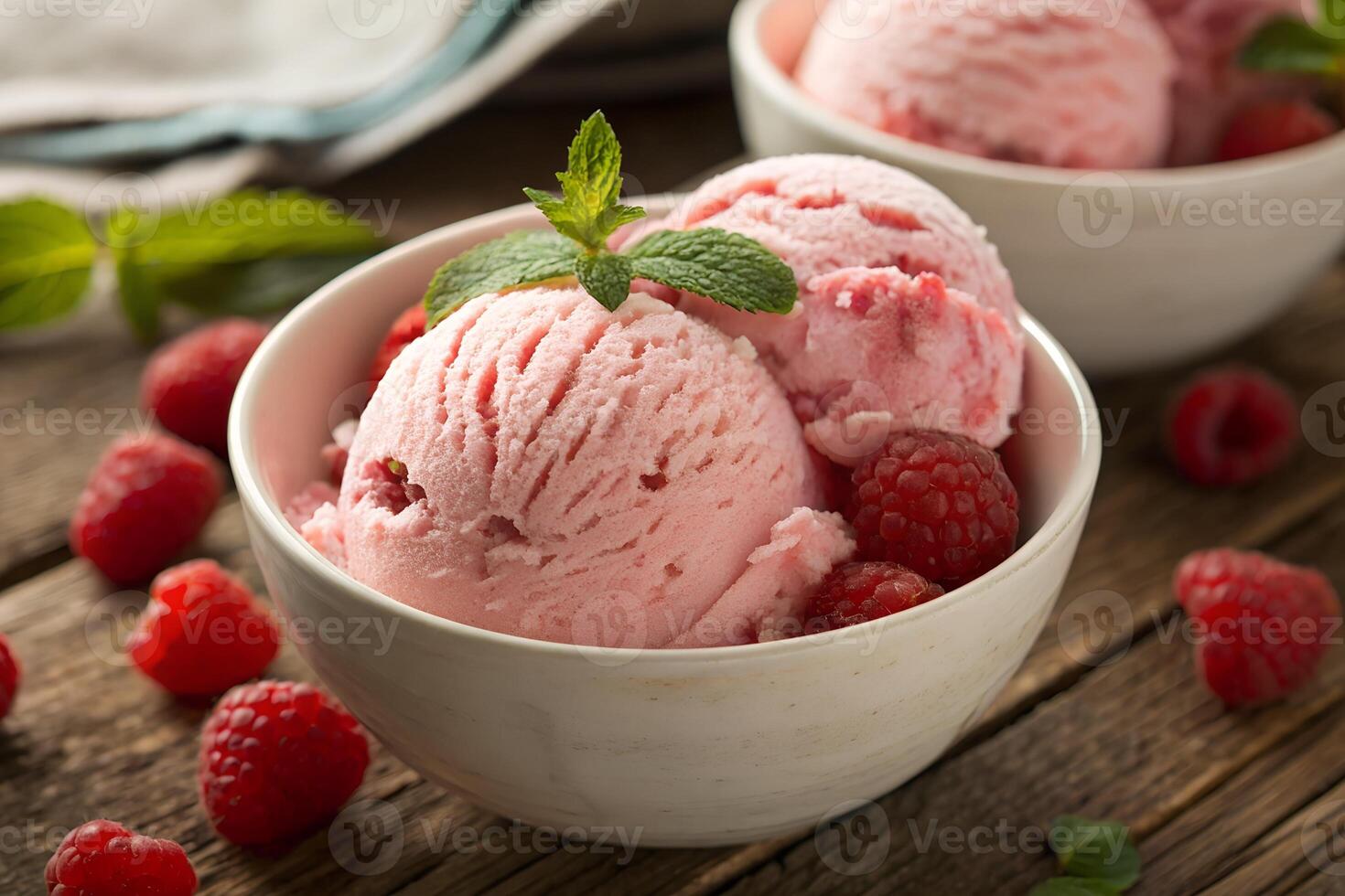 Fresh Raspberry Ice Cream with Mint Leaves in a Bowl photo