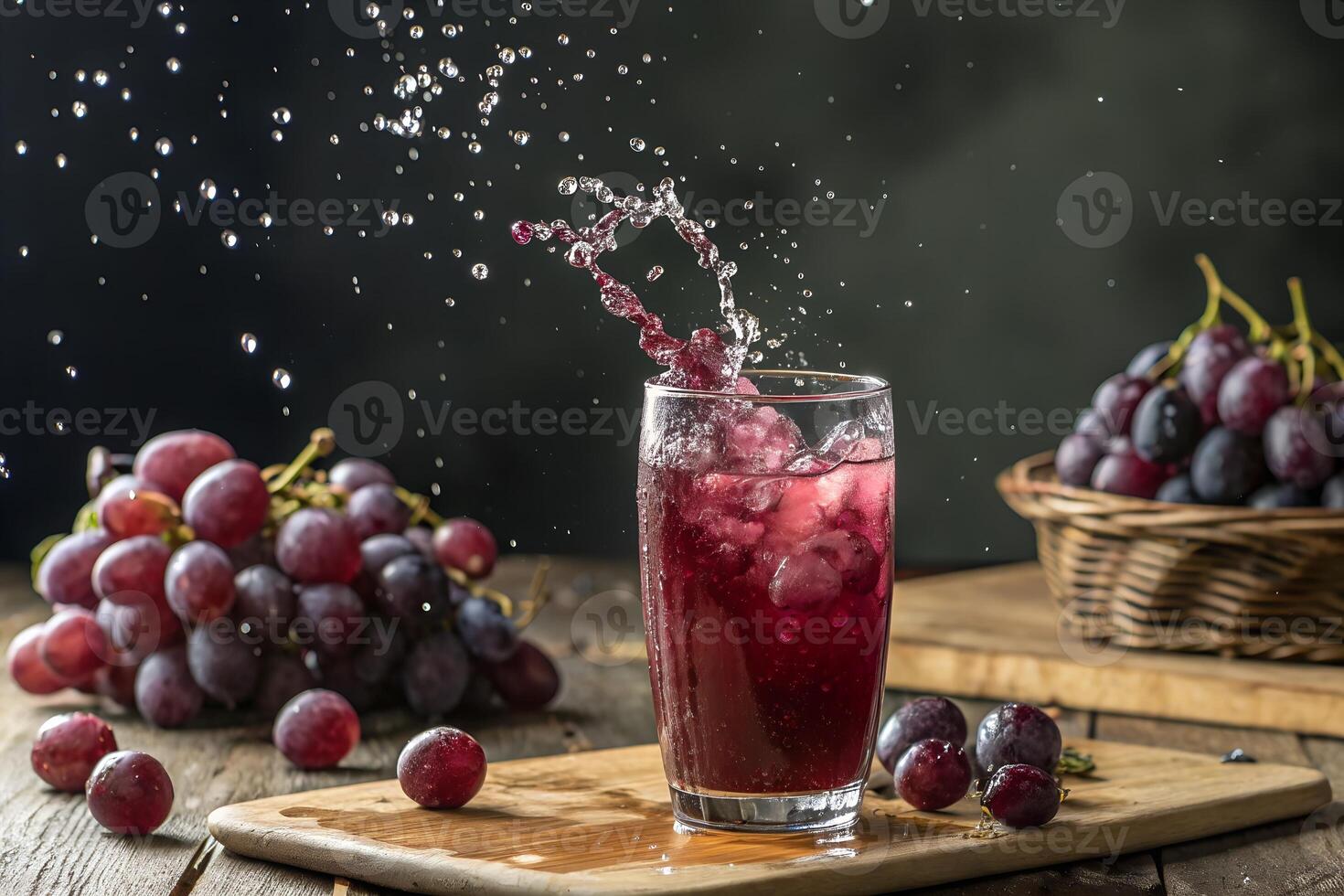 Refreshing Glass of Grape Juice with Splash and Fresh Grapes photo