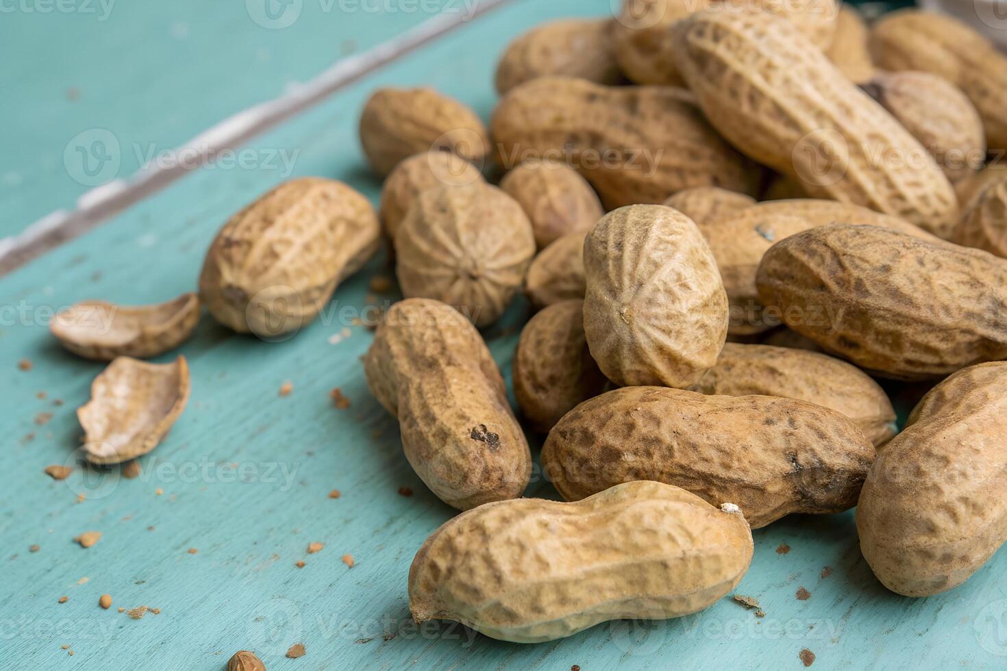 Close-up of Peanuts in Their Shell on a Wooden Surface photo