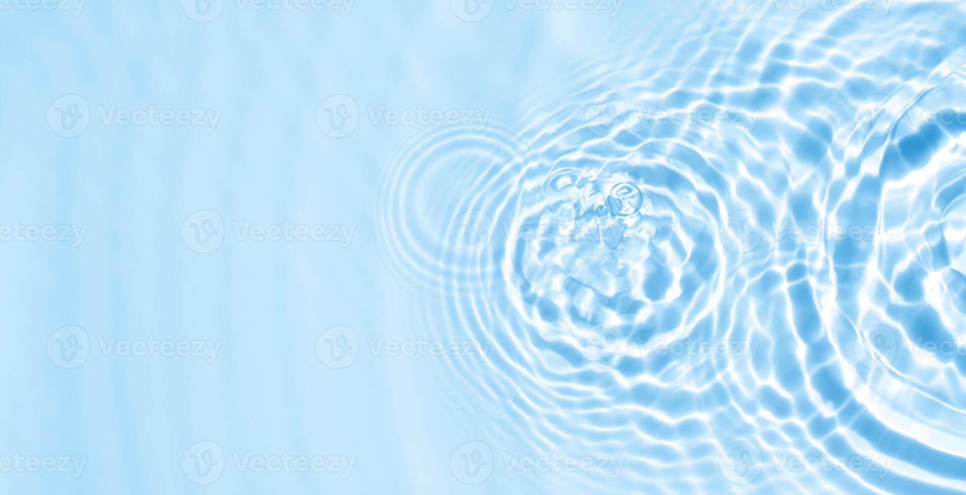 Water Sea Ripper Background,Summer background,Swimming pool with blue water abstract wave surface and circle pattern with copy space for spa, cosmetic product design banner,Sea blue with light effect photo