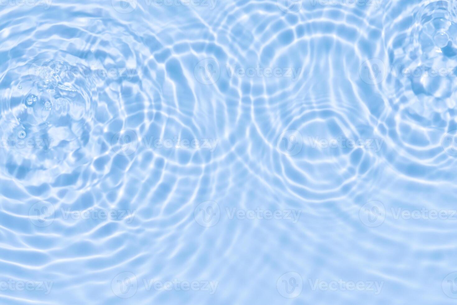 Water background,Sea blue water ripple surface texture with light effect use for Summer background banner,Top view Motion circle wave water in bathroom,Flat lay swimming pool with natural sunlight photo