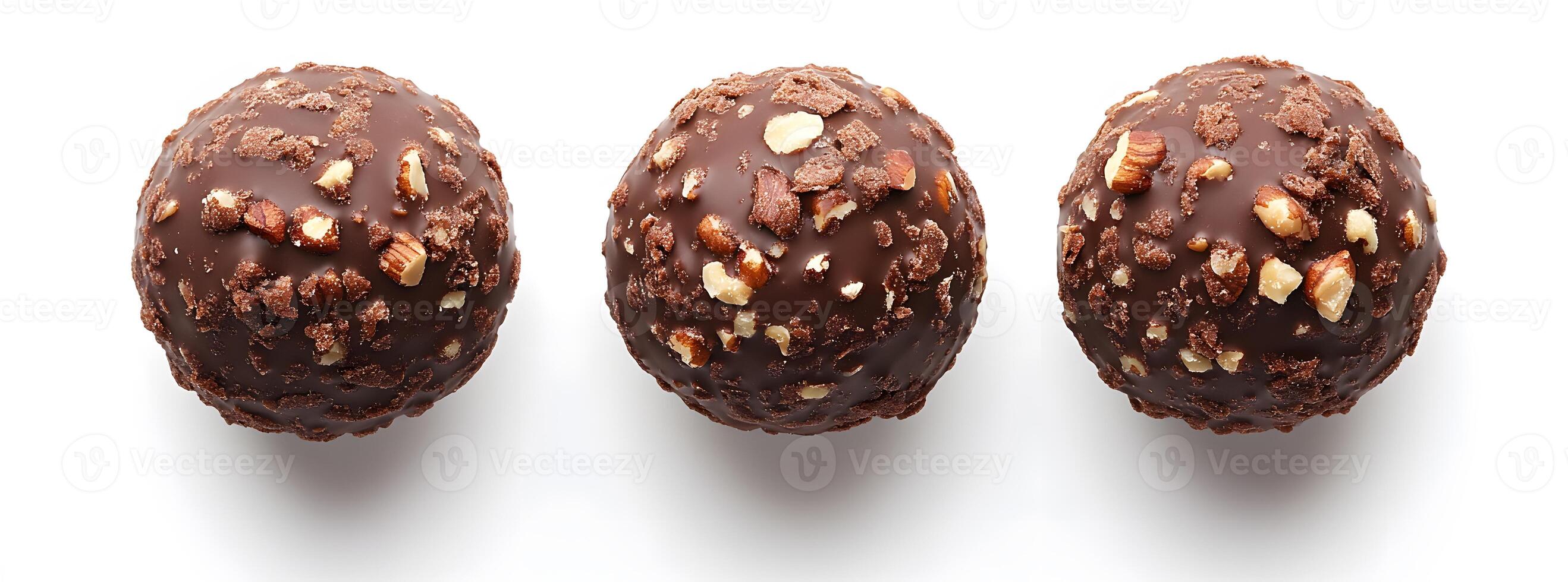 Three Chocolate Covered Nut Candies Arranged in a Row photo