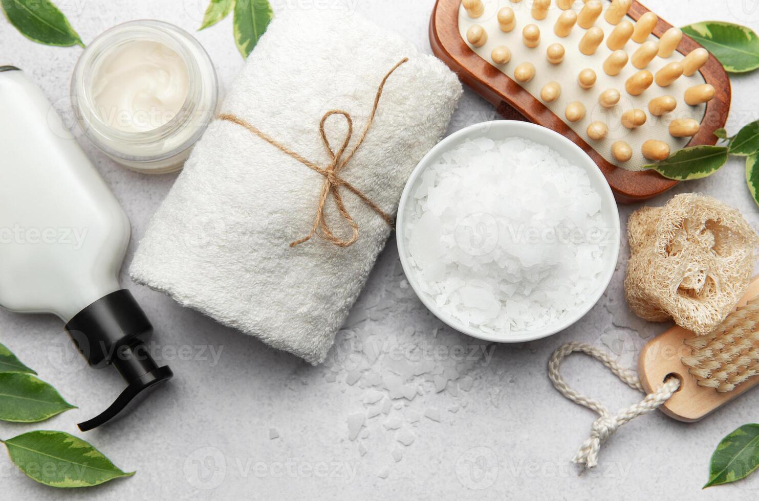 Preparing relaxing wellness magnesium bath with soap, towel and sponge photo