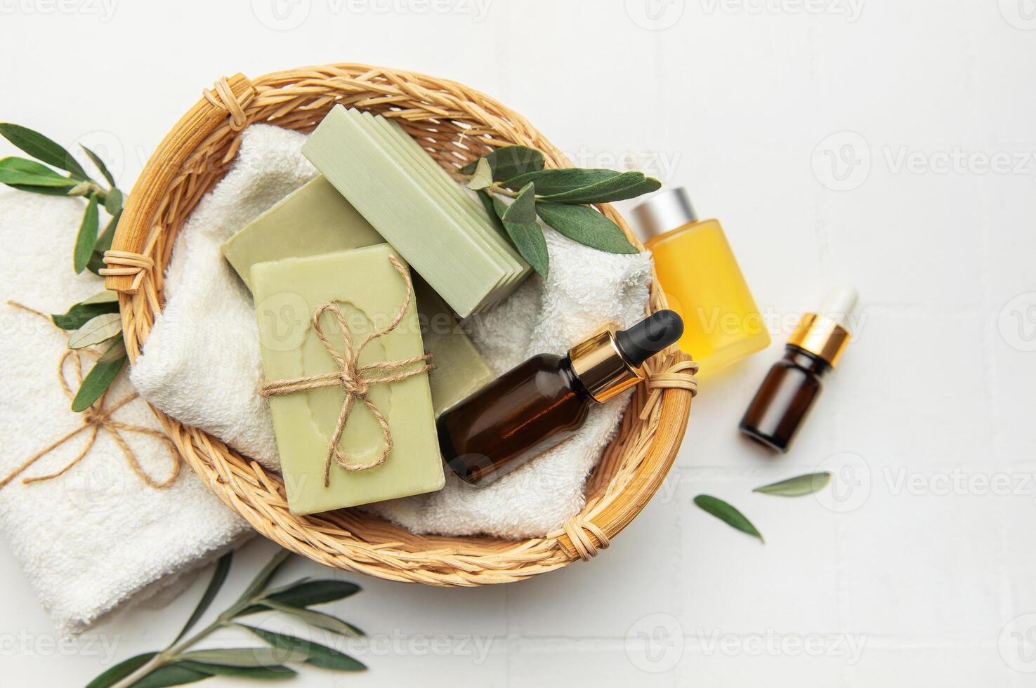 Natural olive soap and essential oil creating relaxing spa atmosphere photo