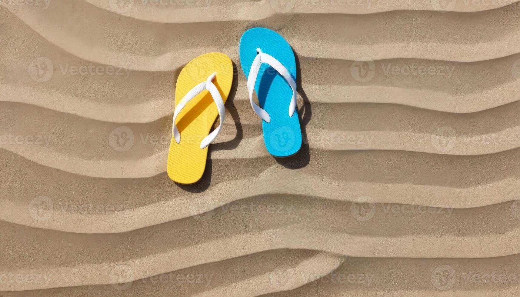 Colorful flip-flops resting on sun-kissed sandy beach, inviting summer fun. Ideal for beachwear promotions, summer vacations, or travel-related content. photo