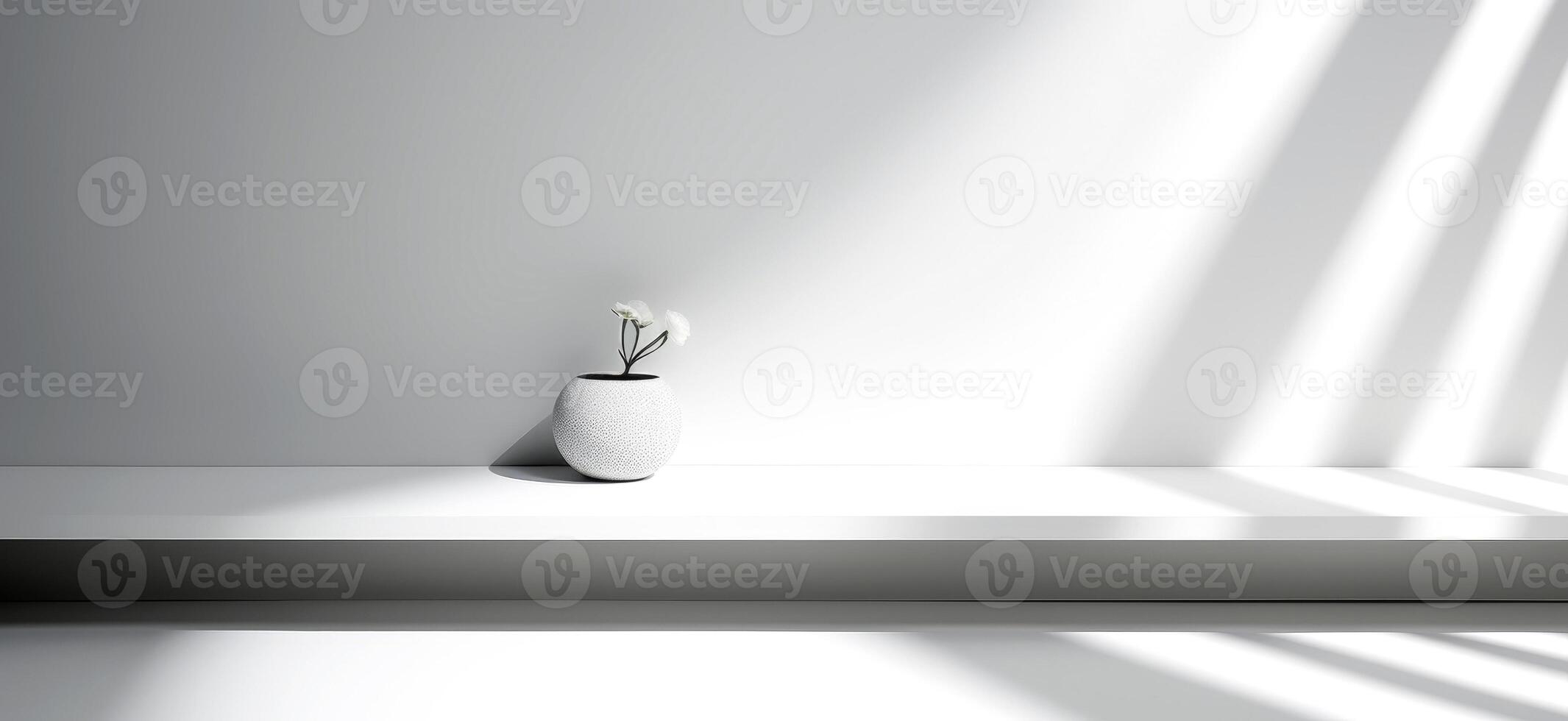 Minimalist interior with a white ceramic vase and delicate flowers placed on a sleek white shelf. The composition emphasizes simplicity, elegance, and modern interior design. photo